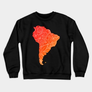 Colorful mandala art map of South America with text in blue and violet Colorful mandala art map of South America with text in red and orange Crewneck Sweatshirt